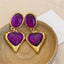 Aretes de corazon morados