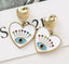 Aretes de corazon y ojo