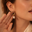 Aretes de corazon pequeños con perla